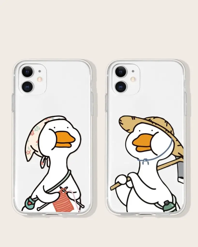 Two smartphones with cases showing cartoon ducks dressed for summer activities, one with a parasol and the other with a hiking stick.