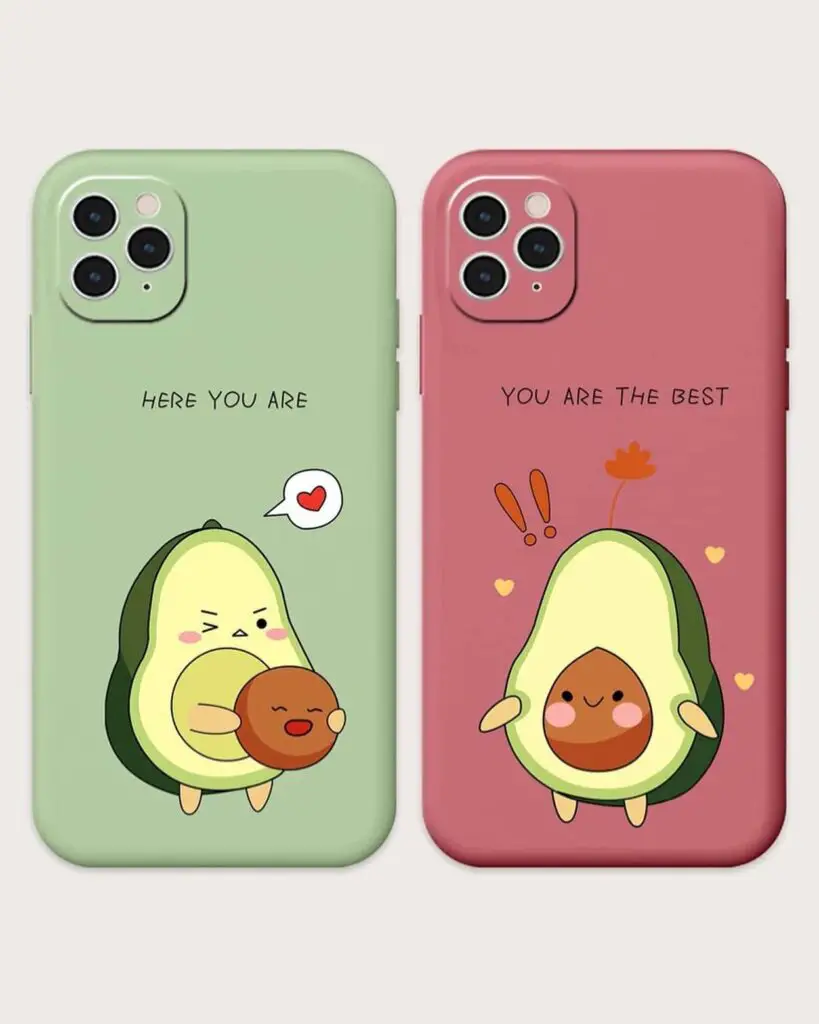 A pair of iPhone cases featuring cute avocado characters hugging a pit, set against contrasting pastel green and pink backgrounds.