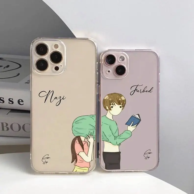 Two iPhone cases with illustrations of a young couple, each on a soft pastel background, one in beige and the other in light pink.
