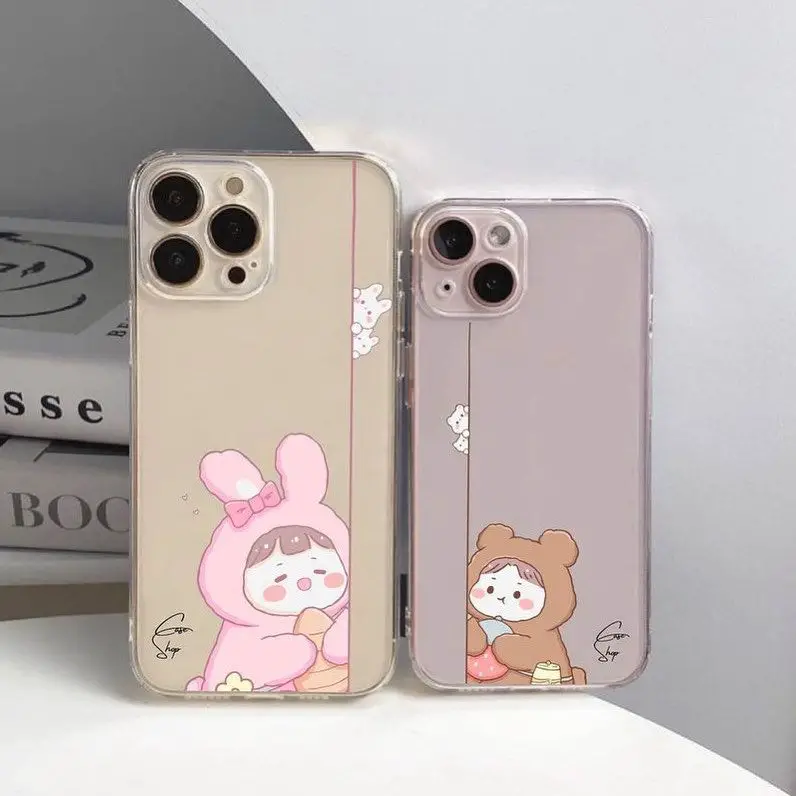 Two iPhone cases with cute critters in vibrant costumes, one pink and one beige, expressing emotions, set against a white background with subtle design elements.