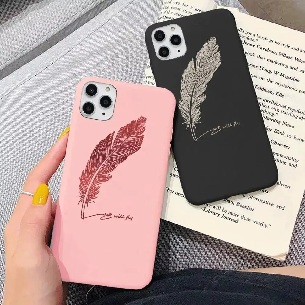A pair of iPhone cases, one pink and one black, each featuring a feather design and the phrase 'We will fly', suggesting aspirations and freedom.