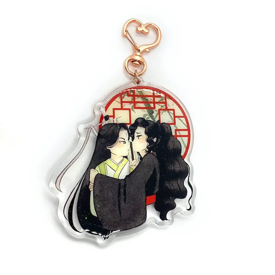 A keychain illustrating an anime couple embracing in front of a red traditional window, detailed with cultural elements.