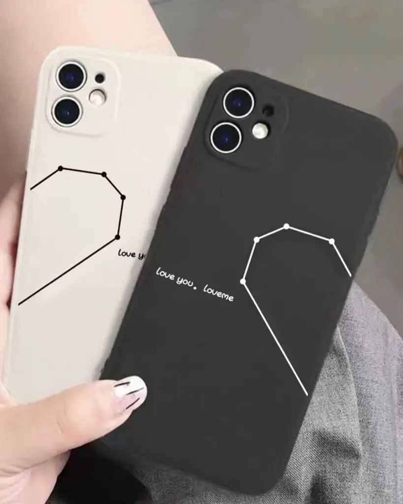 Two iPhone cases, one black and one off-white, with constellation patterns and phrases 'love you' and 'love me' connecting the stars.