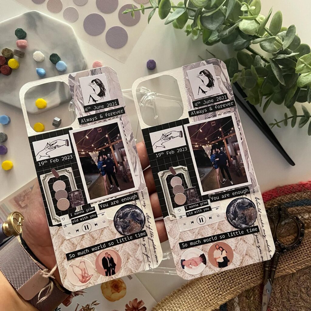 Two transparent smartphone cases held up, filled with personal photos, dates, and romantic quotes in a scrapbook style.